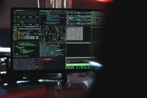Computer screen showing complex code windows.